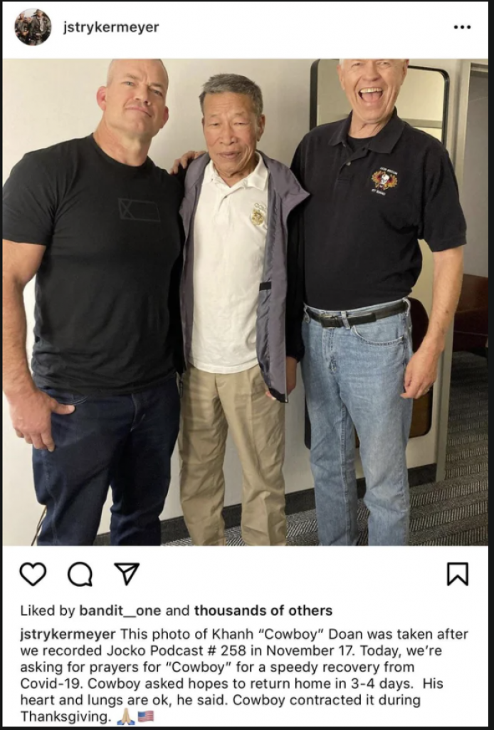 Jocko Willink standing beside 70 year old veteran without any mask or social distancing